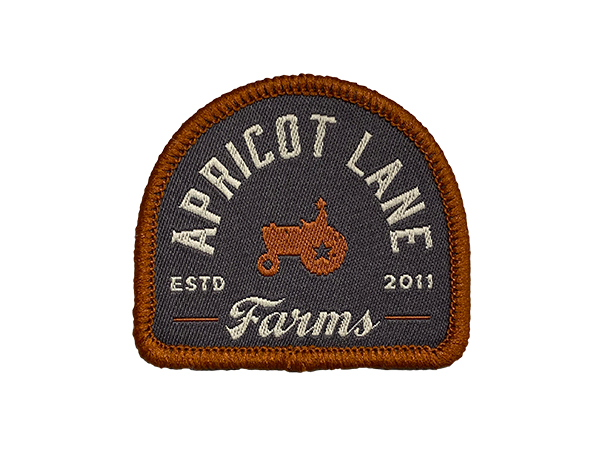 apricot lane emblem in arch shape