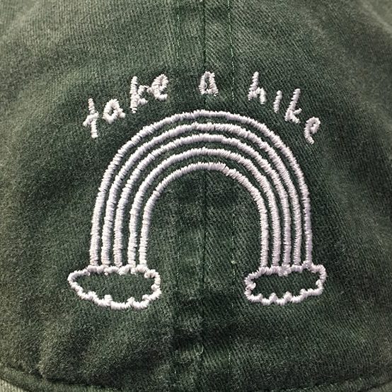 custom_embroidered_logo_on_pigment_wash_hat flat embroidery take a hike logo