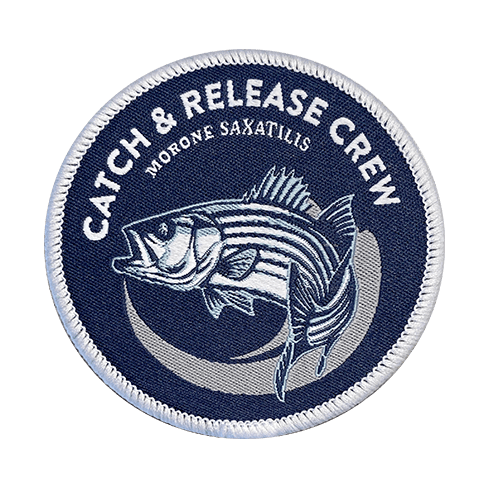 circular emblem with fine detail of fish
